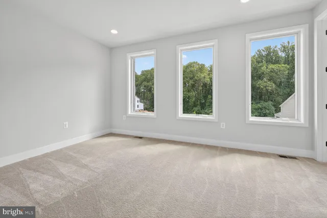 a bathroom with a shower sink and mirror