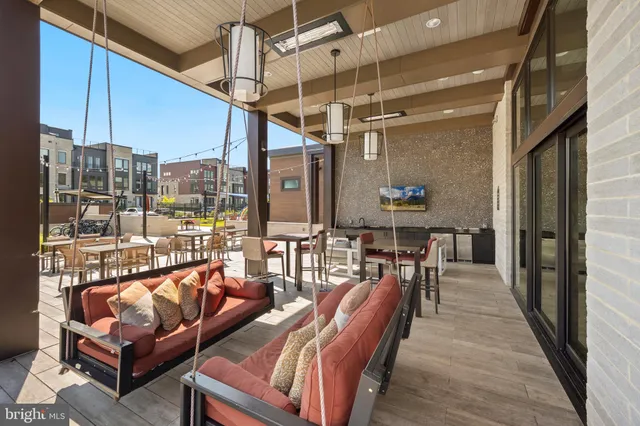 a view of a swimming pool with outdoor seating