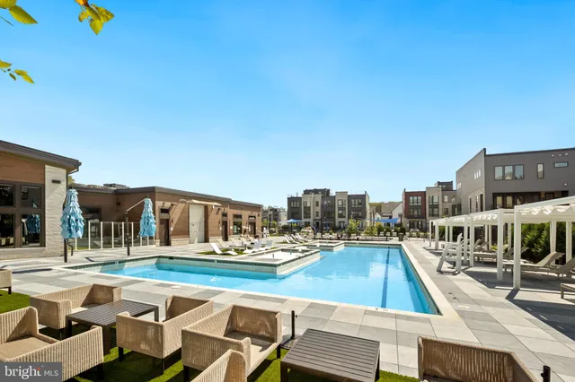 a view of a city with tall buildings and a big yard