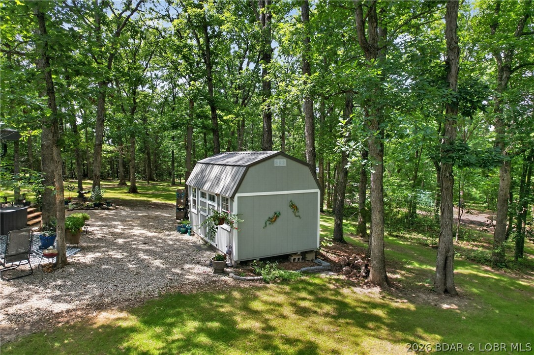 25145 State Route West Barnett, MO 65011 - Photo 30 of 58 SheSHED sits across from the courtyard