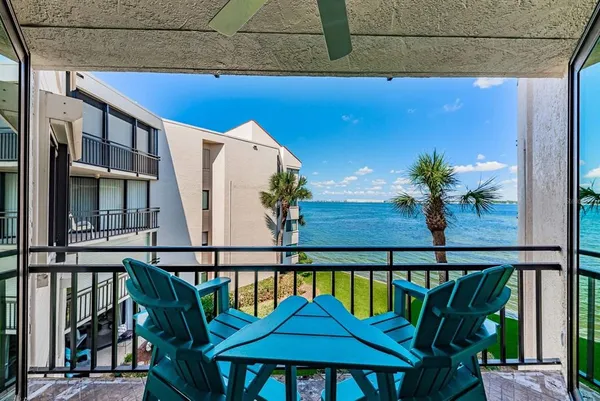 a view of balcony with chairs