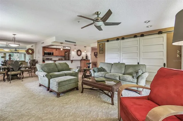 a kitchen with stainless steel appliances granite countertop a sink and a stove