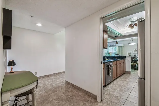 a kitchen with granite countertop a sink and a wooden floor