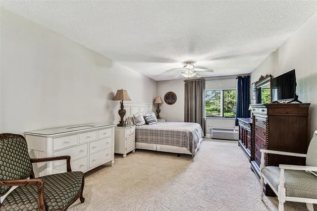 an aerial view of a house a yard and mountain view in back