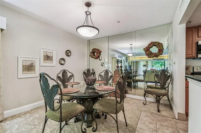 a view of a dining room with furniture window and outside view
