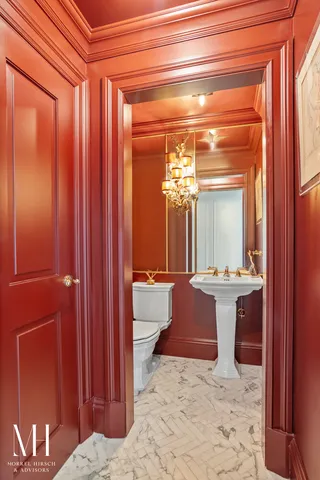 a bathroom with a toilet sink and shower