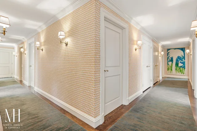 a view of a hallway with wooden shelves