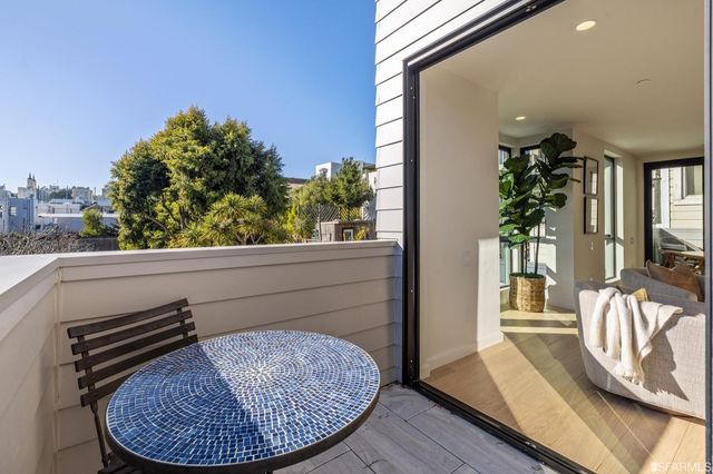 a view of a balcony with a furniture