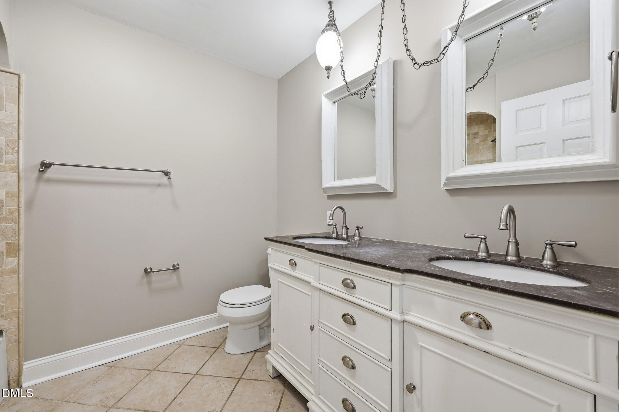 1130 Prospect Church Road Dunn, NC 28334 - Photo 28 of 47 a bathroom with a granite countertop sink a toilet and a mirror