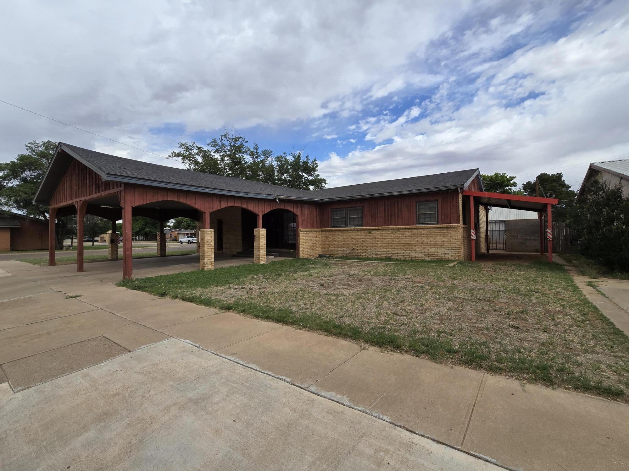 506 North 19th Street Lamesa, TX 79331 - Photo 27 of 29 a front view of a house with a yard and garage