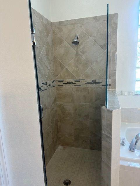 2614 Hartwood Pines Way Clermont, FL 34711 - Photo 12 of 25 a bathroom with a shower