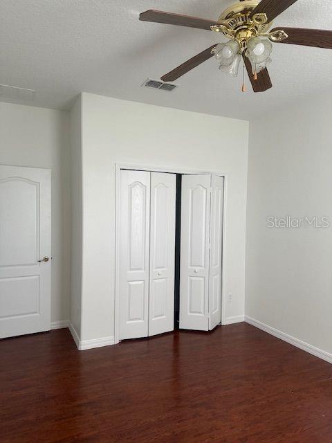 2614 Hartwood Pines Way Clermont, FL 34711 - Photo 16 of 25 a view of an empty room with wooden floor