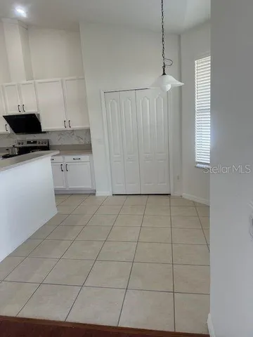 a kitchen with a stove a sink and a refrigerator
