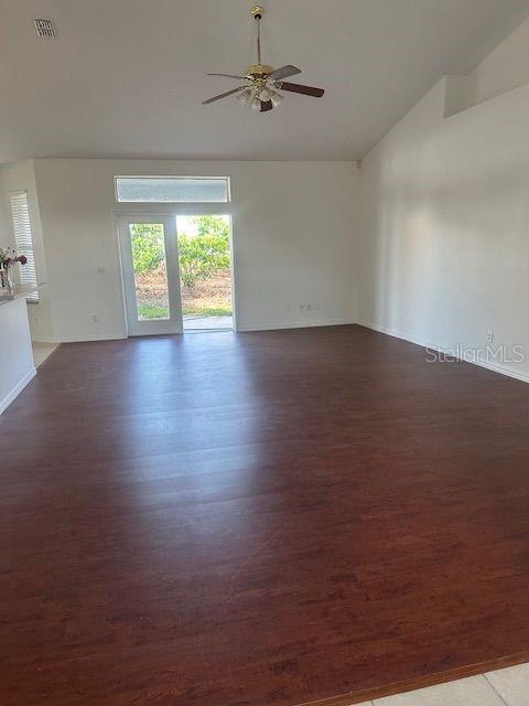 2614 Hartwood Pines Way Clermont, FL 34711 - Photo 8 of 25 an empty room with wooden floor and windows