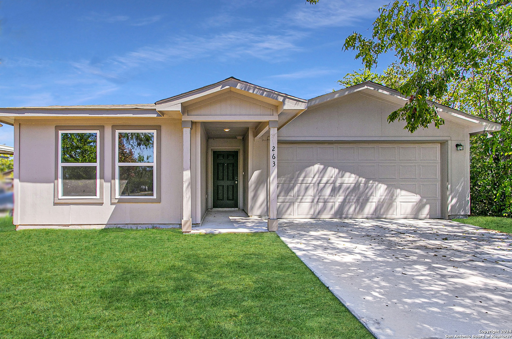 263 Doolittle Street San Antonio, TX 78211 - Photo 1 of 1 front view of house with a yard
