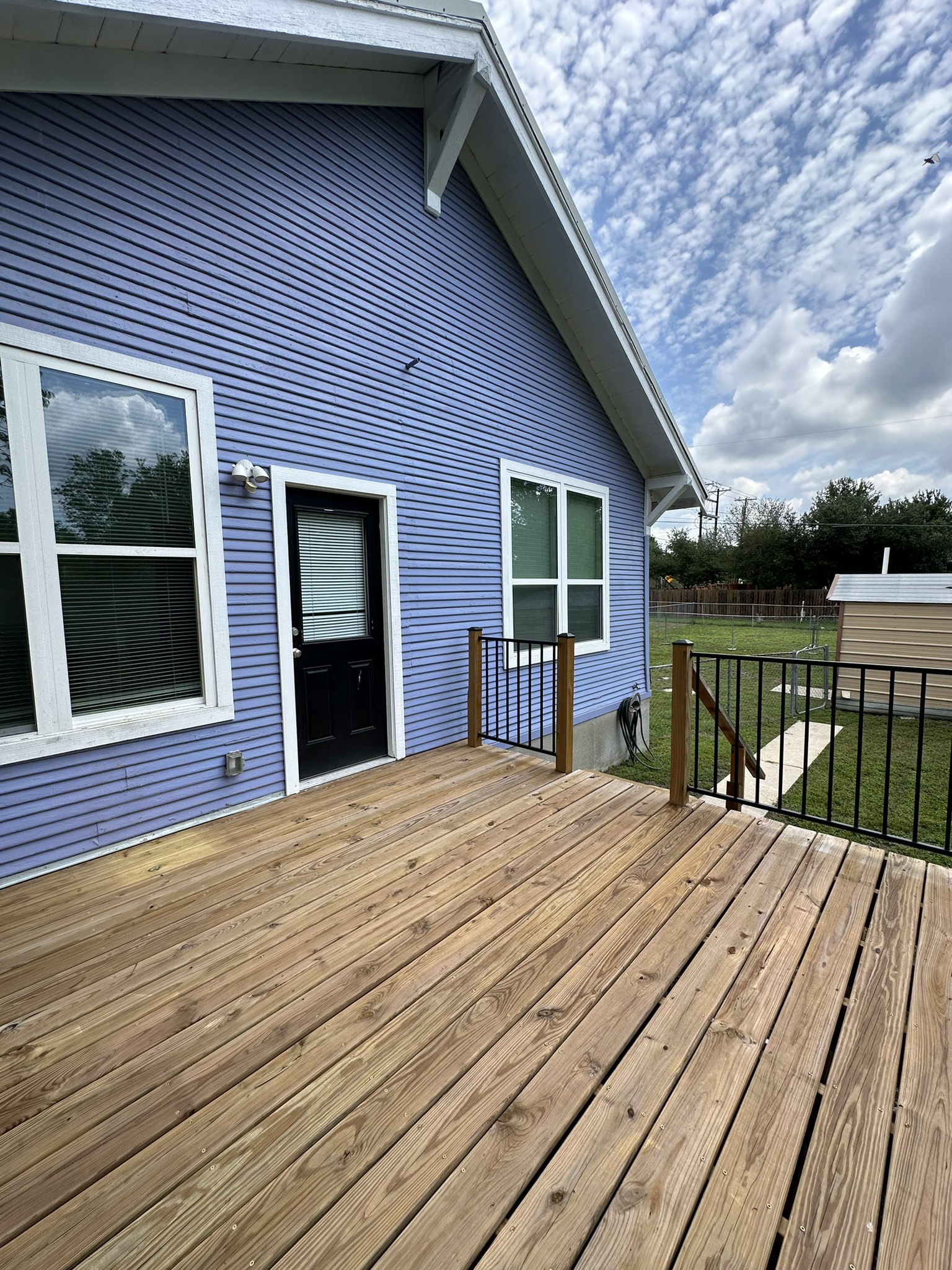 719 West 3rd Street Taylor, TX 76574 - Photo 30 of 31 View of wooden deck