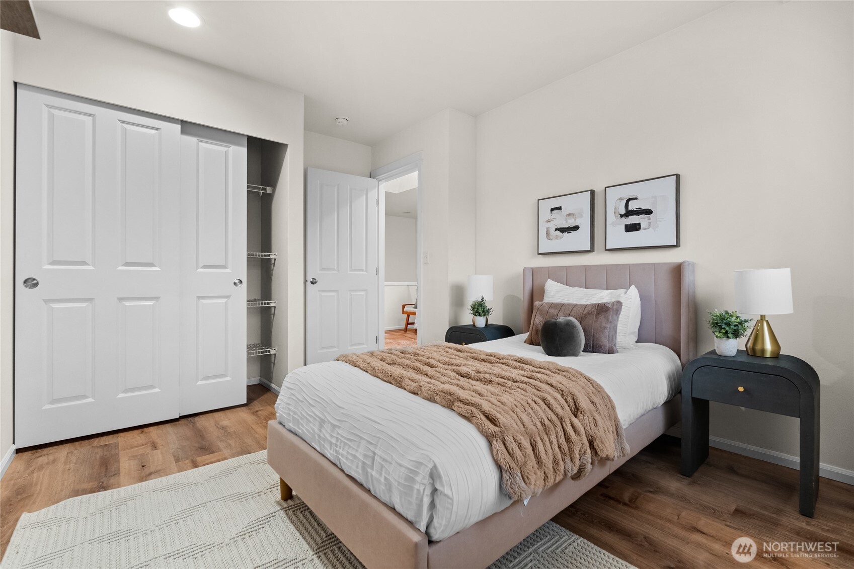 18708 109 Lane Southeast, Unit K30 Renton, WA 98055 - Photo 16 of 36 a bedroom with a bed and painting on the wall