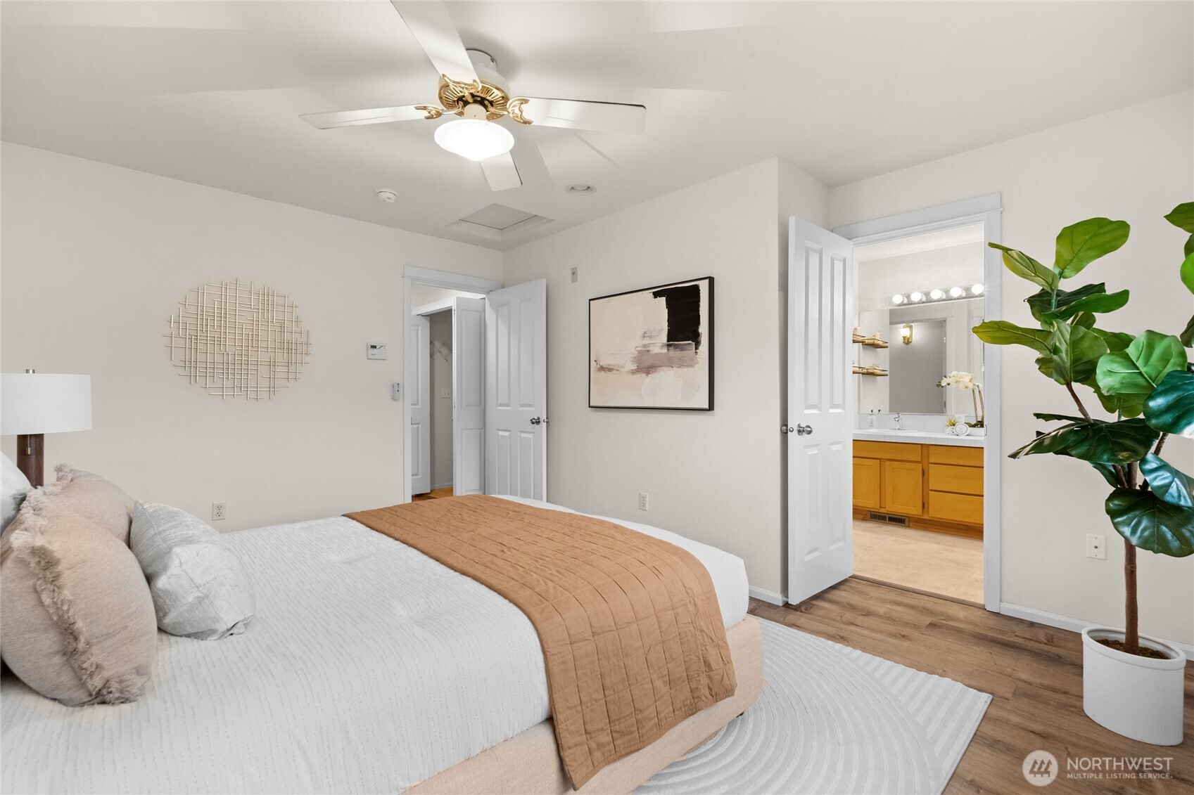 18708 109 Lane Southeast, Unit K30 Renton, WA 98055 - Photo 20 of 36 a bedroom with a bed and a plant