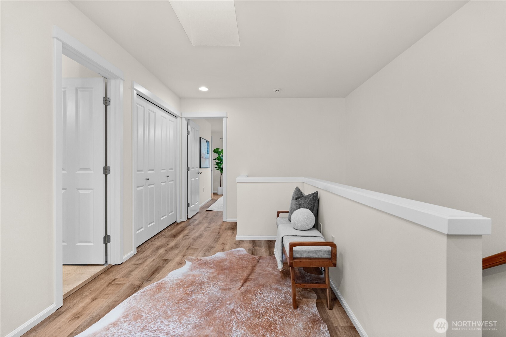 18708 109 Lane Southeast, Unit K30 Renton, WA 98055 - Photo 26 of 36 a hallway with a chair and a dining table