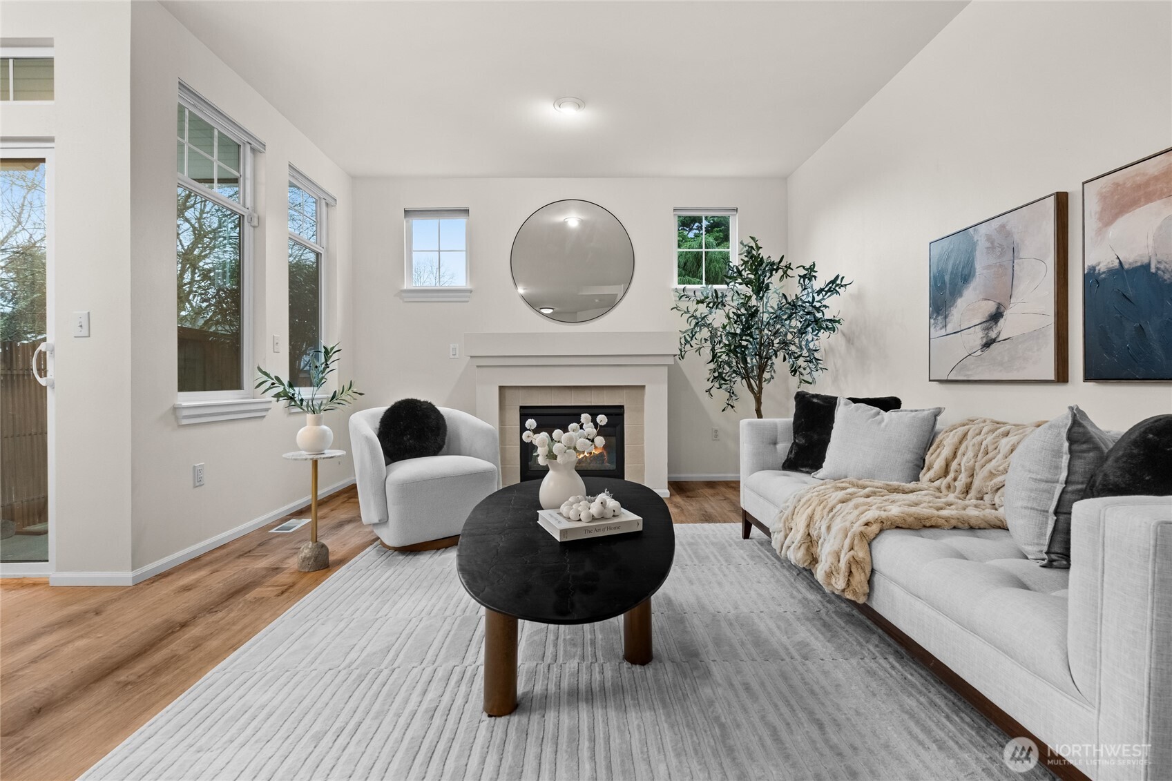 18708 109 Lane Southeast, Unit K30 Renton, WA 98055 - Photo 5 of 36 a living room with furniture a fireplace and potted plants