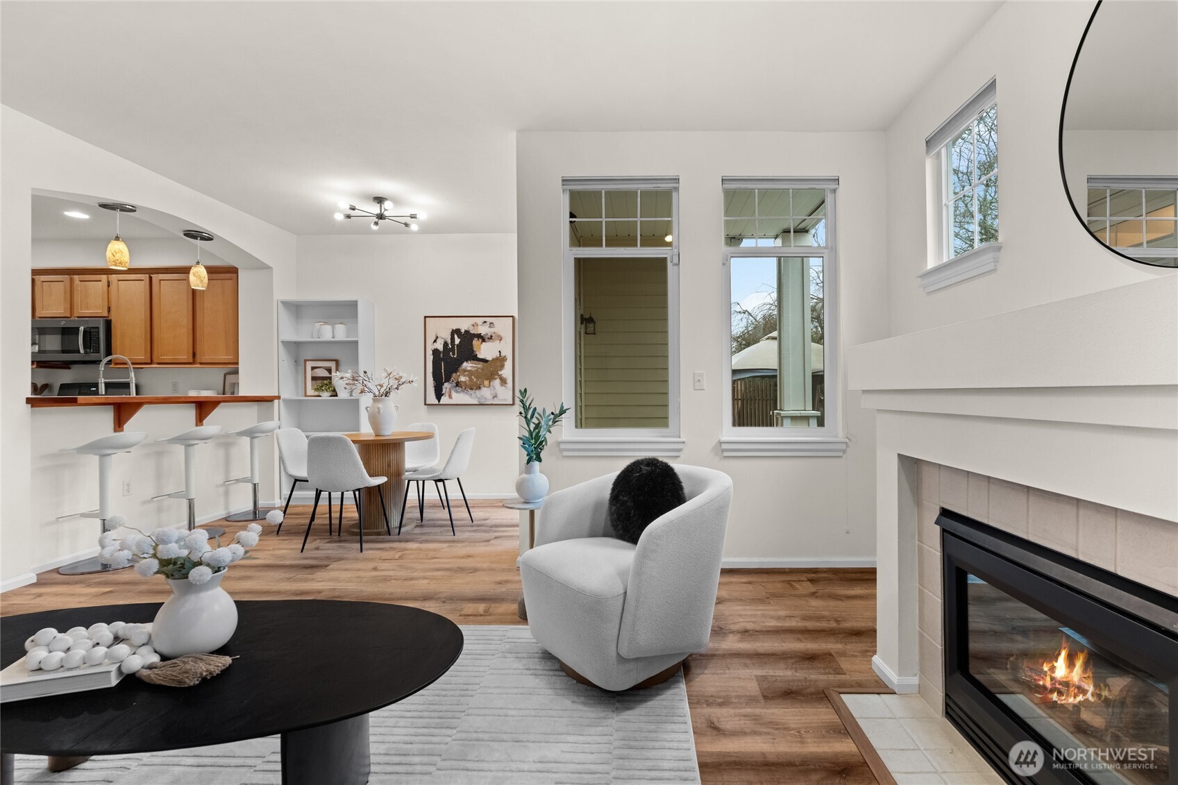 18708 109 Lane Southeast, Unit K30 Renton, WA 98055 - Photo 6 of 36 a living room with furniture and a fireplace