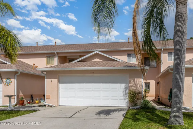 a front view of house with yard and seating area