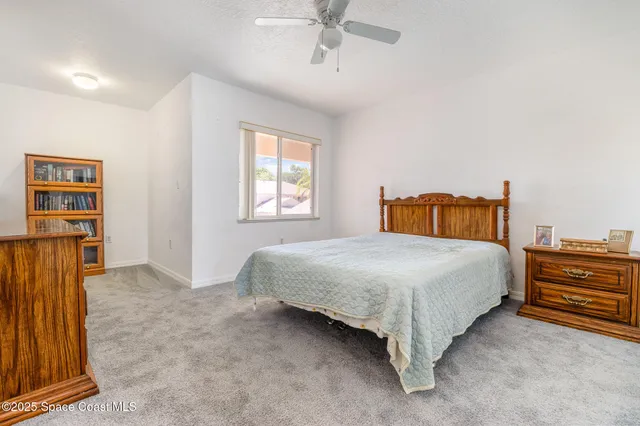 a bedroom with a bed and dresser