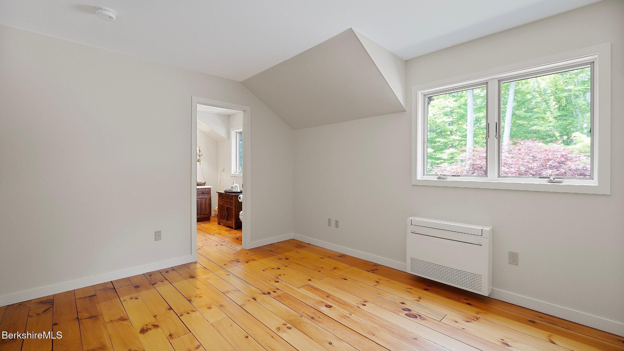 173 Hillsdale Road Egremont, MA 01230 - Photo 62 of 82 a view of empty room with wooden floor and fan