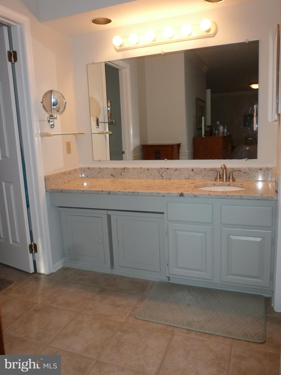 125 Environs Road Sterling, VA 20165 - Photo 17 of 26 Granite Vanity top & custom tile flooring