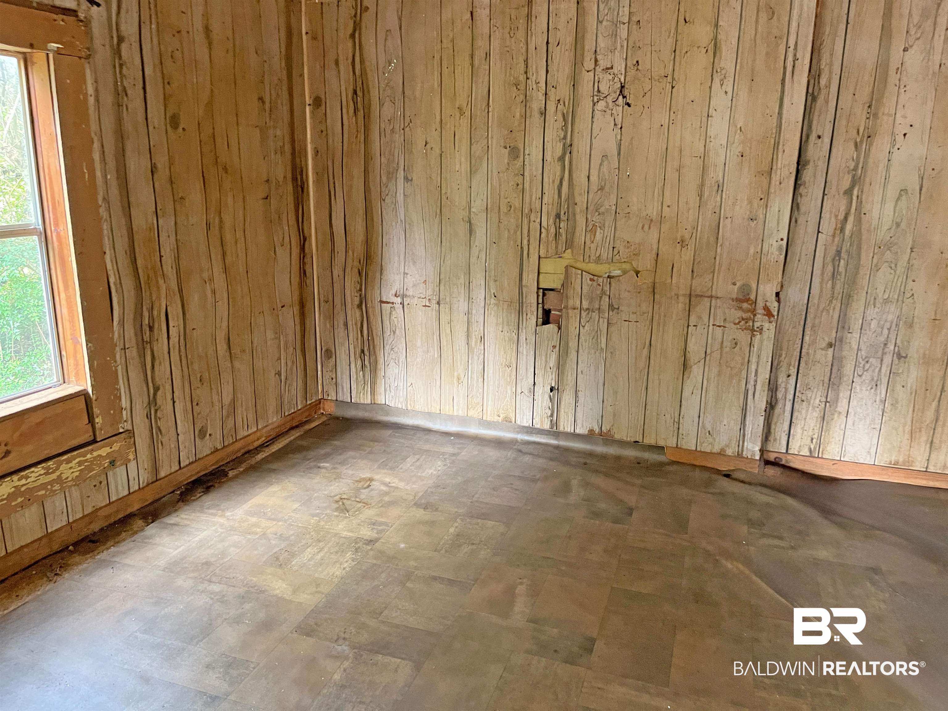 139 Rutherford Street Monroeville, AL 36460 - Photo 4 of 6 Spare room with wooden walls
