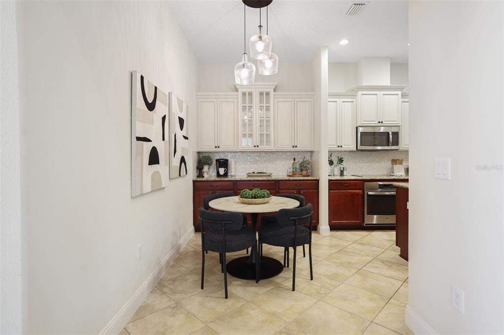 27211 Hawks Nest Circle Wesley Chapel, FL 33544 - Photo 12 of 58 a kitchen with stainless steel appliances kitchen island granite countertop a sink and a stove