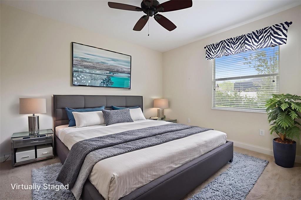 27211 Hawks Nest Circle Wesley Chapel, FL 33544 - Photo 38 of 58 a bedroom with bed and a window