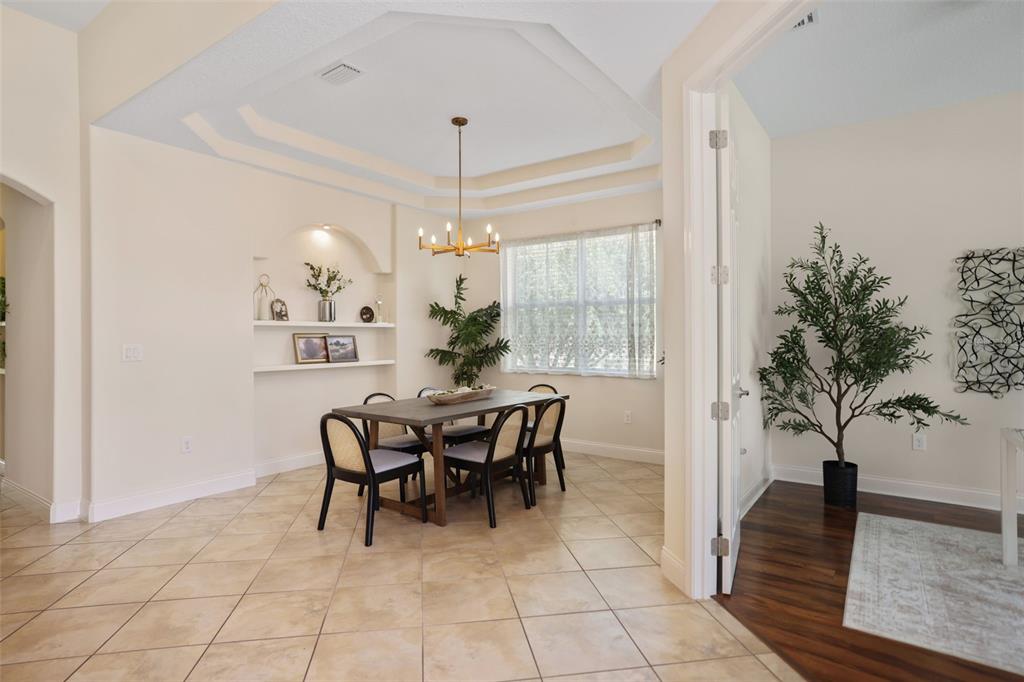 27211 Hawks Nest Circle Wesley Chapel, FL 33544 - Photo 9 of 58 a view of a dining room with furniture and chandelier