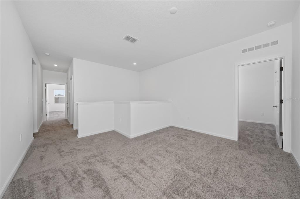 6061 Shavasana Road Clermont, FL 34714 - Photo 13 of 33 an empty room with white walls