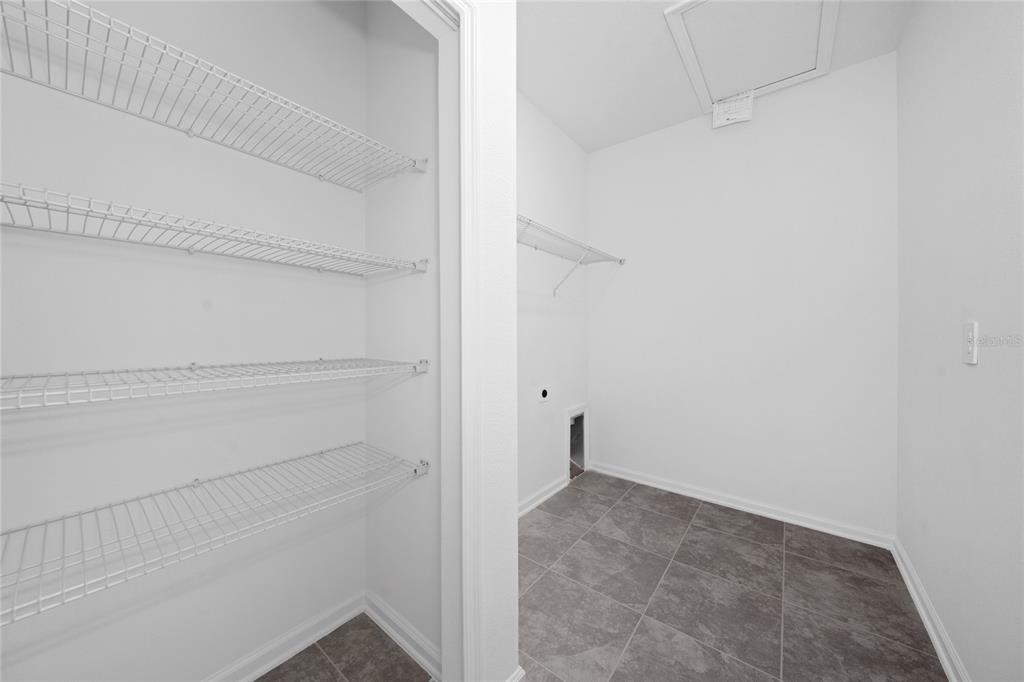 6061 Shavasana Road Clermont, FL 34714 - Photo 14 of 33 a view of an empty walk in closet