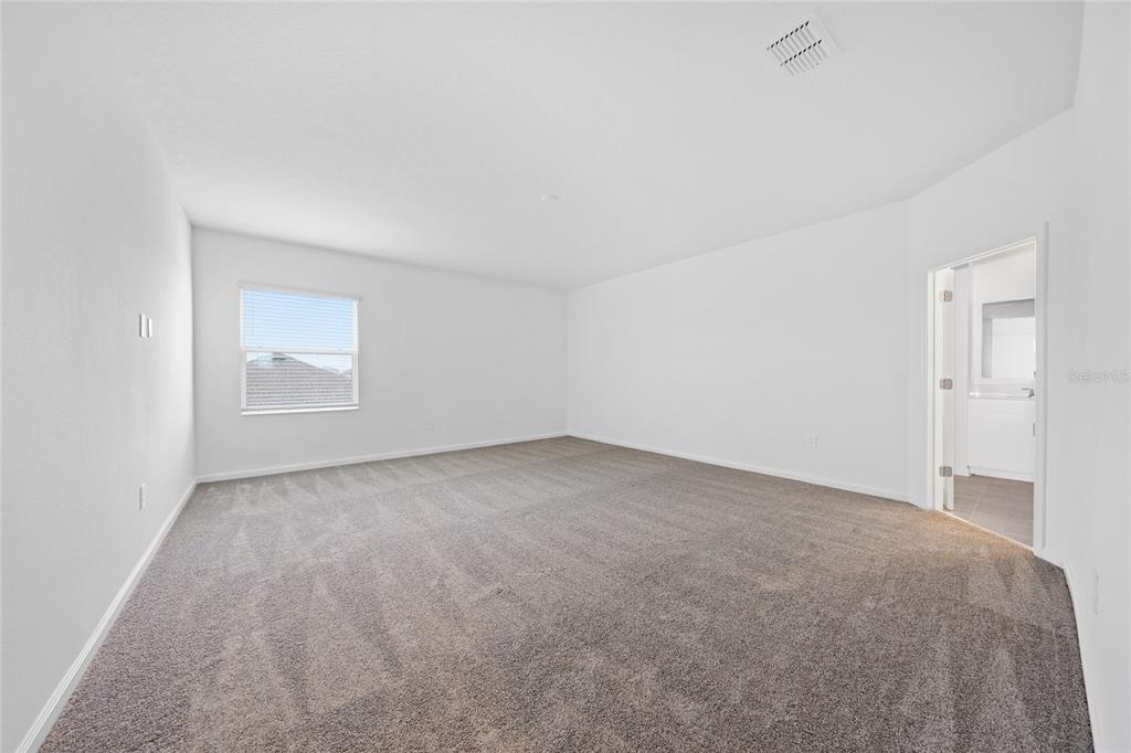 6061 Shavasana Road Clermont, FL 34714 - Photo 15 of 33 a view of an empty room and a window