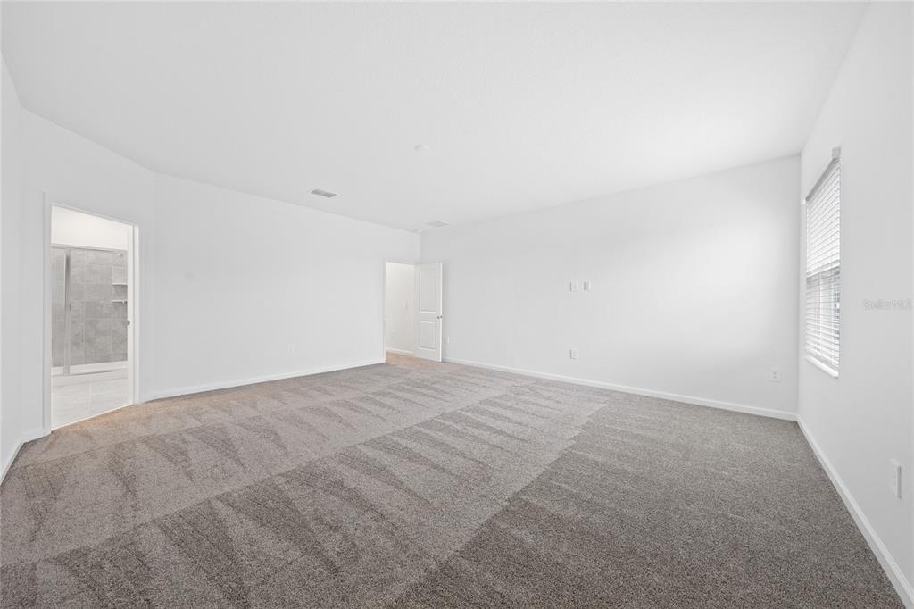 6061 Shavasana Road Clermont, FL 34714 - Photo 16 of 33 a view of an empty room and window