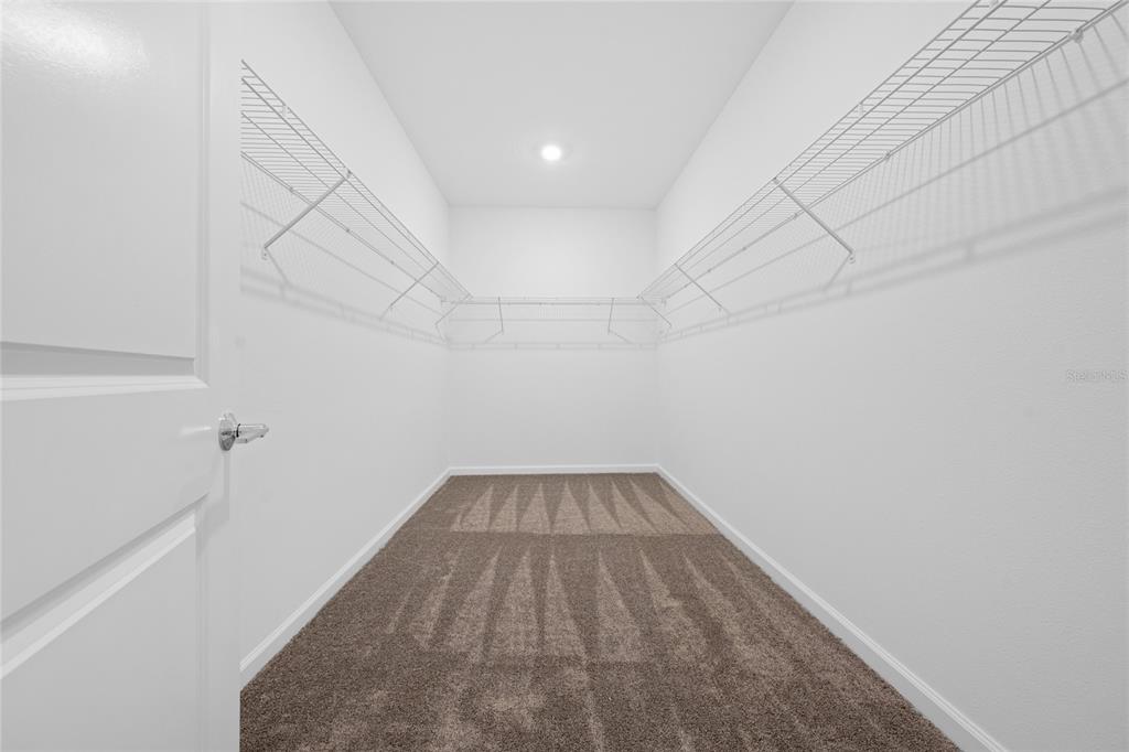 6061 Shavasana Road Clermont, FL 34714 - Photo 19 of 33 a view of a room with wooden floor