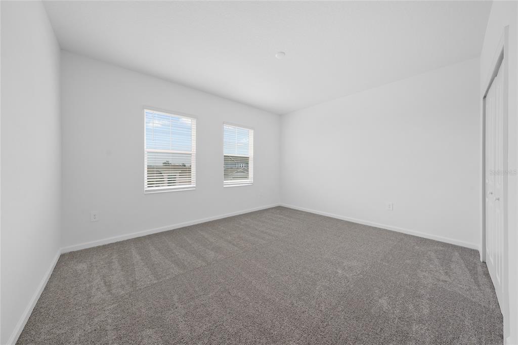 6061 Shavasana Road Clermont, FL 34714 - Photo 23 of 33 an empty room with windows