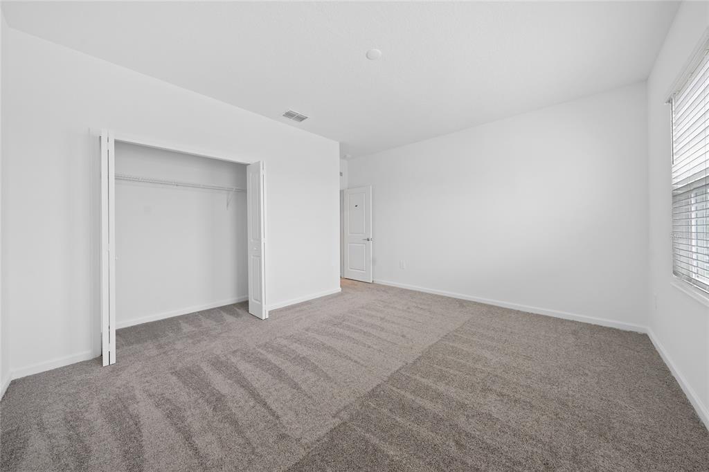 6061 Shavasana Road Clermont, FL 34714 - Photo 24 of 33 a view of an empty room with a window