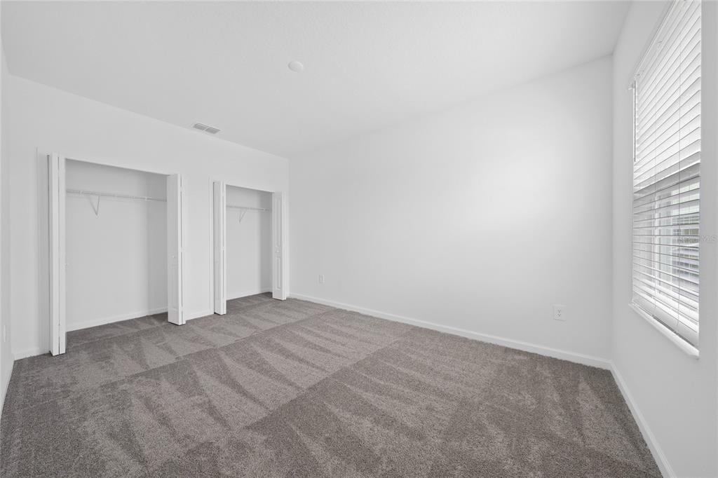 6061 Shavasana Road Clermont, FL 34714 - Photo 25 of 33 a view of an empty room with a window