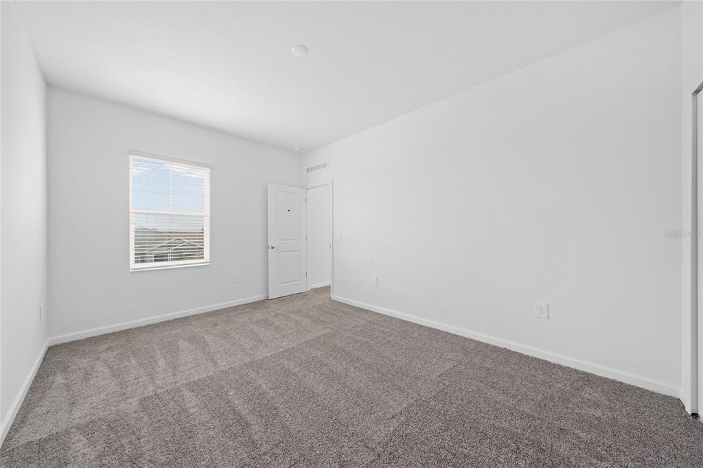 6061 Shavasana Road Clermont, FL 34714 - Photo 26 of 33 an empty room with a window