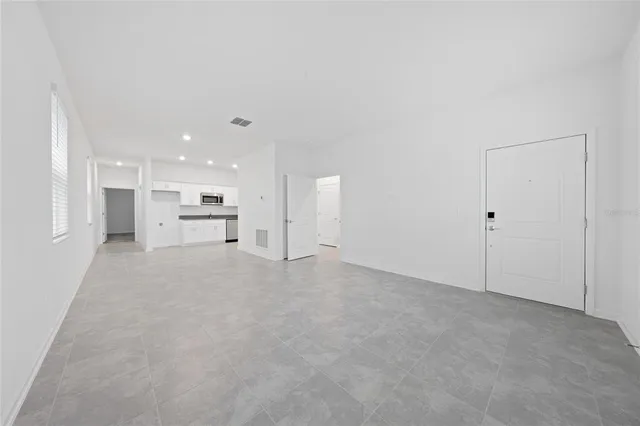 a kitchen with granite countertop a sink and a stove top oven