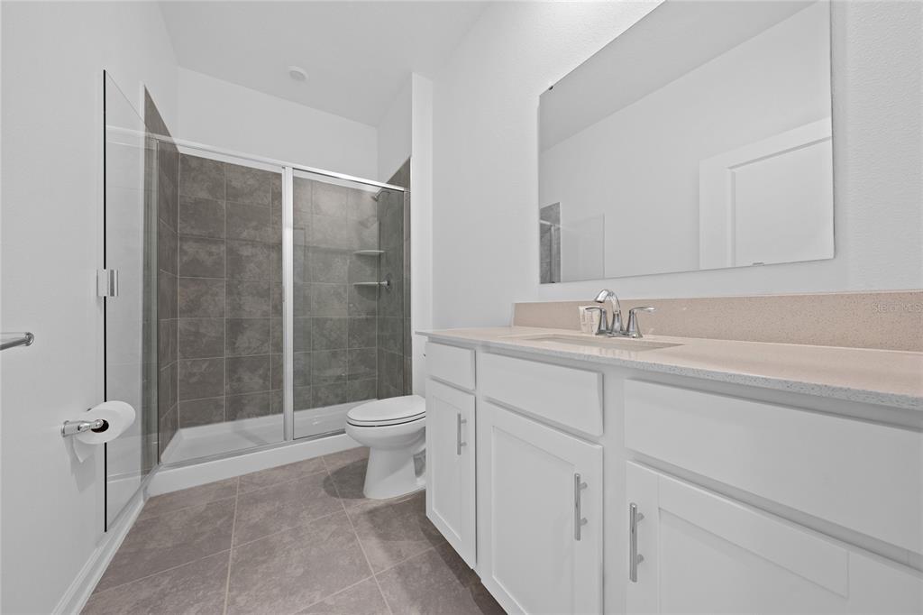 6061 Shavasana Road Clermont, FL 34714 - Photo 30 of 33 a bathroom with a sink a toilet and shower