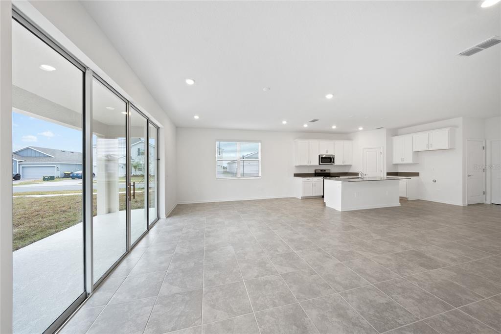 6061 Shavasana Road Clermont, FL 34714 - Photo 10 of 33 a view of kitchen with stainless steel appliances refrigerator oven and cabinets