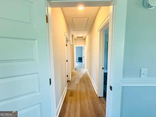 a view of a bathroom from a hallway