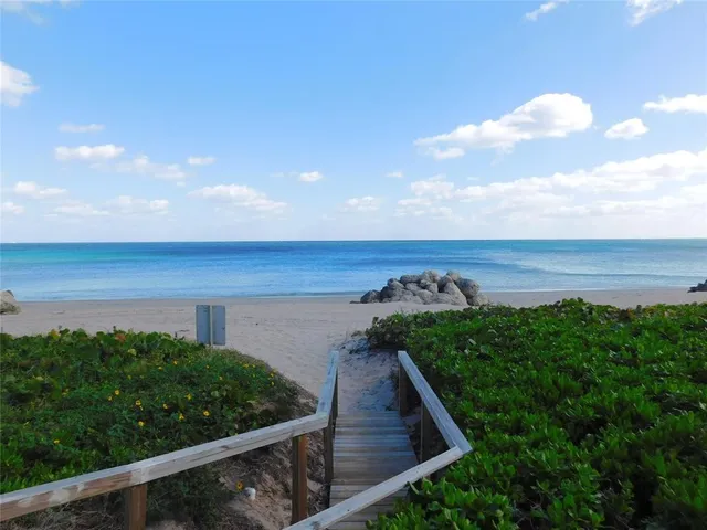 a view of a backyard of a house with lots of green space
