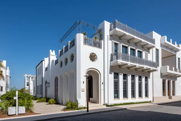 a front view of a building with garden