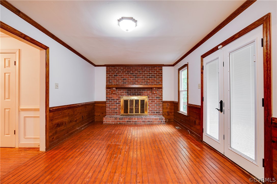 8403 Spring Meadow Road Richmond, VA 23235 - Photo 14 of 19 a view of a hallway with wooden floor and staircase
