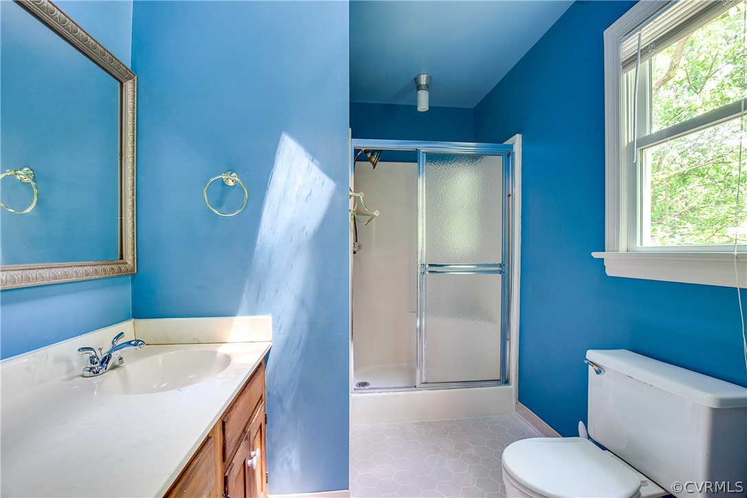 8403 Spring Meadow Road Richmond, VA 23235 - Photo 17 of 19 a bathroom with a sink toilet and shower